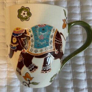 Dutch Wax by Coastline Imports ceramic mug with elephant and floral pattern.